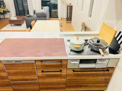 a kitchen with a counter top with pots and pans at Zaki-House-EG0307 in Tokyo