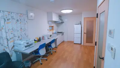 a room with a kitchen with a table and chairs at \u6771\u8cc0\u65c5\u9928 in Tokyo