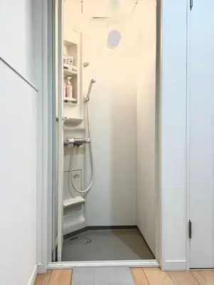 a walk in shower in a bathroom with a glass door at Koenji loft apartment/Shinjuku&Kichijoji/JR in Tokyo