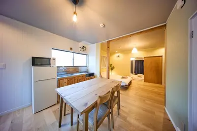 a kitchen and dining room with a wooden table at futaba heights - Vacation STAY 15532 in Tokyo