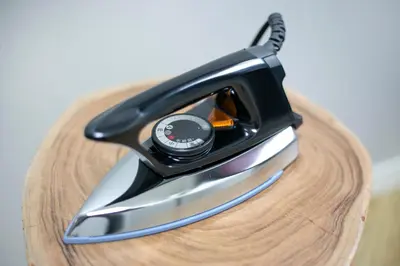 a iron sitting on top of a wooden table at \u30ea\u30a2\u30eb\u9326\u7cf8101 in Tokyo
