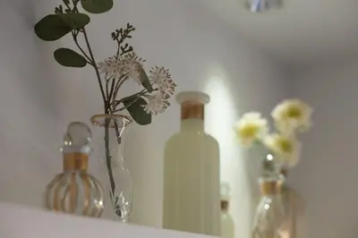 a group of vases with flowers in them on a shelf at Hotel Blanche \u5927\u4eba\u5c02\u7528 Adult only hotel in Tokyo