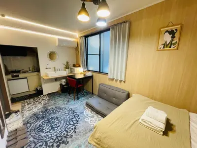 a bedroom with a bed and a desk and a sink at Sky house\u6674\u7a7a\u58543 in Tokyo