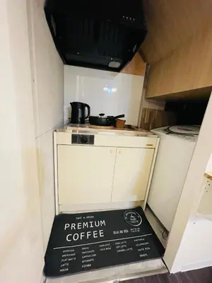 a pentium coffee box sitting on the floor of a kitchen at Sky house\u6674\u7a7a\u58543 in Tokyo