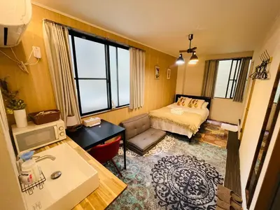 a small room with a bed and a couch at Sky house\u6674\u7a7a\u58543 in Tokyo