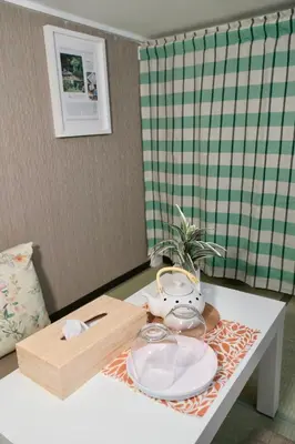 a table with two plates and glasses on it at Sky house\u6674\u7a7a\u5854106 in Tokyo
