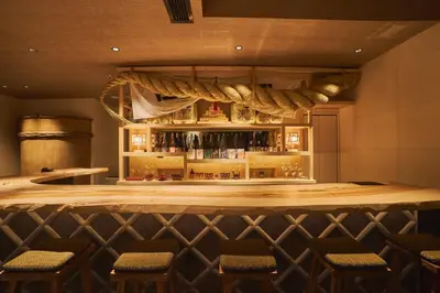 a bar in a restaurant with chairs around it at SAKE Bar Hotel Asakusa in Tokyo
