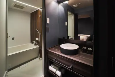 a bathroom with a sink and a mirror at SAKE Bar Hotel Asakusa in Tokyo
