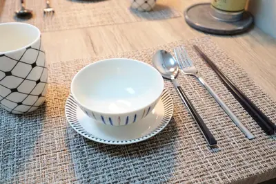 a bowl on a plate next to a fork and spoon at \u5922\u306e\u820e \u65b0\u5bbf Yumenoya Shinjuku in Tokyo