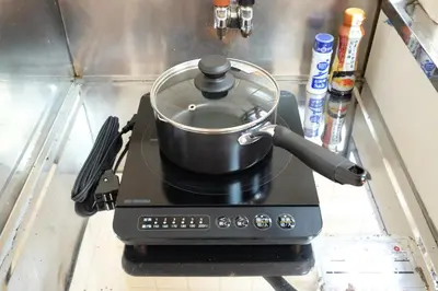 a pot sitting on top of a stove at \u5922\u306e\u820e \u65b0\u5bbf Yumenoya Shinjuku in Tokyo