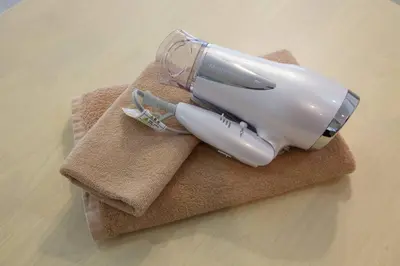 a bottle is sitting on top of a towel at PALAIS GRACE 301 in Tokyo