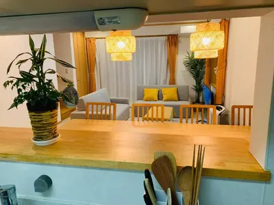 a living room with a table with a potted plant at Kamei House - Vacation STAY 07100v in Tokyo