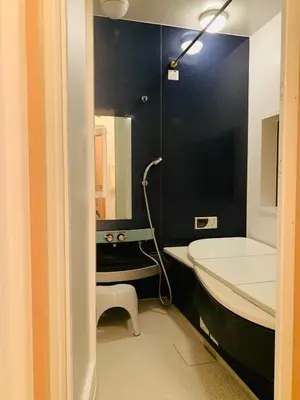 a bathroom with a tub and a toilet and a sink at Kamei House - Vacation STAY 07100v in Tokyo
