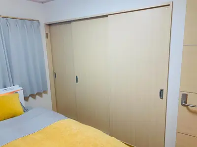 a bedroom with a bed and a closet at Kamei House - Vacation STAY 07100v in Tokyo