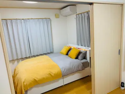 a small bedroom with a bed and a window at Kamei House - Vacation STAY 07100v in Tokyo