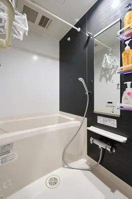 a bathroom with a shower and a bath tub at Shinjuku colorbee pretty house103 in Tokyo