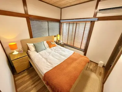 a small bedroom with a bed and a window at TOKYO HOSHI VILLIA-Private Villa in Tokyo ideal for groups and families in Tokyo