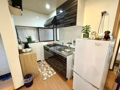 a small kitchen with a sink and a refrigerator at TOKYO HOSHI VILLIA-Private Villa in Tokyo ideal for groups and families in Tokyo