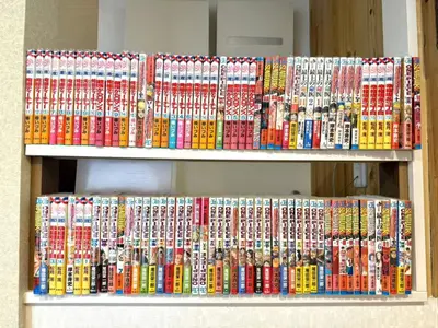 two shelves of video games on display at TOKYO HOSHI VILLIA-Private Villa in Tokyo ideal for groups and families in Tokyo