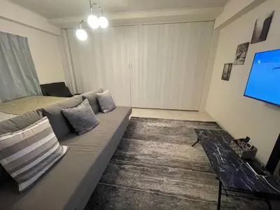 a living room with a couch and a tv at Oak Stay Shimokitazawa Luxury Family size 2min Shimokitazawa sta Shinjuku Shibuya7min by train in Tokyo