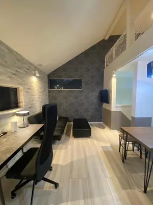a room with a desk and a chair and a table at Shibuya Stay Tokyo A204 in Tokyo