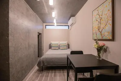 a small room with a bed and a table at 2mins walk to Ueno station (Tokyo)-YoE9 in Tokyo