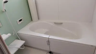 a white tub in a bathroom with a sink at \u6c60\u888b\u5feb\u901f\u4e00\u99c5kyoka house in Tokyo