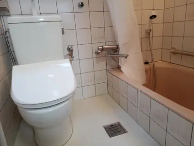 a bathroom with a toilet and a bath tub at \u6c60\u888b\u5feb\u901f\u4e00\u99c5kyoka house in Tokyo