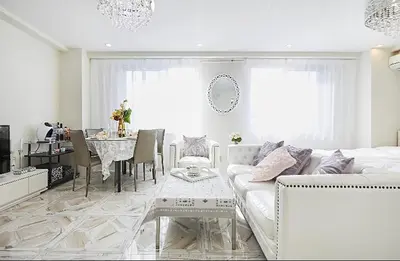 a living room with a white couch and a table at Reimi Mondo501 in Tokyo