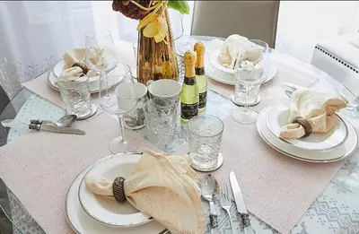 a table with plates and wine glasses on it at Reimi Mondo501 in Tokyo