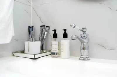 a bathroom shelf with complimentary products on it at Reimi Mondo301 in Tokyo