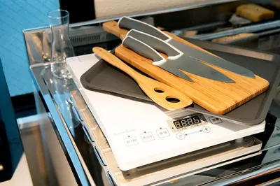 a pair of knives sitting on top of an appliance at #2 3stops to Shinjuku station stylish spacious studio apartment in Tokyo