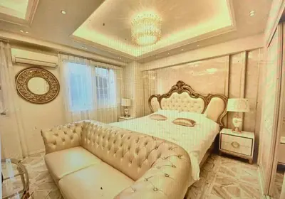 a bedroom with a large bed and a couch at Reimi Mondo201 in Tokyo