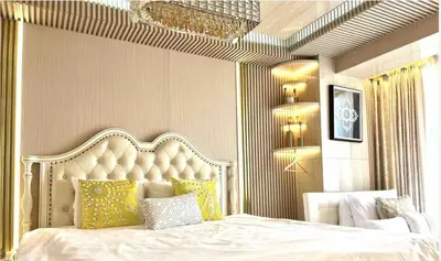 a bedroom with a large white bed with yellow pillows at Reimi Mondo702 in Tokyo