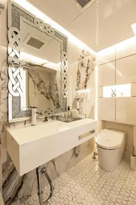 a bathroom with a sink and a toilet and a mirror at Reimi Mondo602 in Tokyo