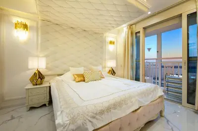 a bedroom with a large bed and a large window at Reimi Mondo602 in Tokyo