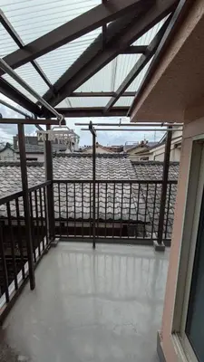 an empty balcony with a view of the water at Tokyo Skytree Tower\u30fbAsakusa Ashiana Guest House in Tokyo