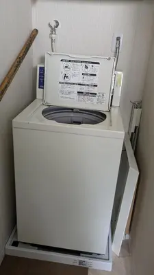 a washer and dryer sitting in a room at Tokyo Skytree Tower\u30fbAsakusa Ashiana Guest House in Tokyo