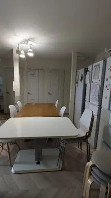 a room with a table and chairs in a room at Tokyo Skytree Tower\u30fbAsakusa Ashiana Guest House in Tokyo