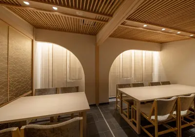 a conference room with two tables and chairs at \u30e2\u30c0\u30f3\u548c\u98a8\u6c11\u5bbf \u7c8bSui \u4e0a\u91ce Asakusa in Tokyo