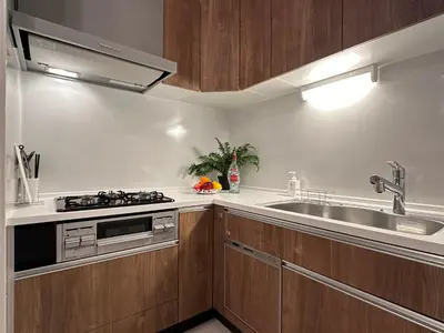 a kitchen with a sink and a stove top oven at nestay villa tokyo sugamo in Tokyo