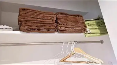 a shelf in a refrigerator with three towels at Marvelous Kinshicho - Vacation STAY 61712v in Tokyo