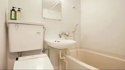 a bathroom with a toilet and a sink and a tub at Marvelous Kinshicho - Vacation STAY 61712v in Tokyo