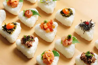 a bunch of small food items on a plate at OMO5 Tokyo Gotanda by Hoshino Resorts in Tokyo