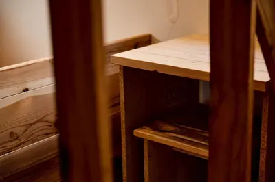 a room with a wooden table and a wooden shelf at \u3010Hotel Futaba HeightsC\u3011good access, up to 5 guests in Tokyo