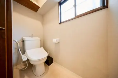 a bathroom with a white toilet with a window at \u3010Hotel Futaba HeightsC\u3011good access, up to 5 guests in Tokyo