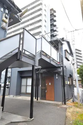 a building with a stairway in front of a building at \u3010Hotel Futaba HeightsC\u3011good access, up to 5 guests in Tokyo