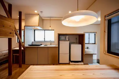 a kitchen with a refrigerator and a sink at \u3010Hotel Futaba HeightsC\u3011good access, up to 5 guests in Tokyo