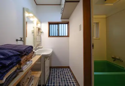 a bathroom with a sink and a bath tub at Lucky Aoto \u30e9\u30c3\u30ad\u30fc\u9752\u6238 in Tokyo