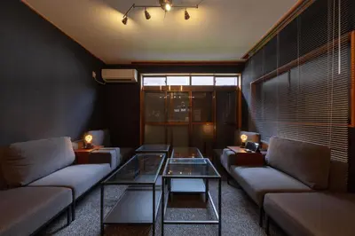 a living room with couches and a glass table at Lucky Aoto \u30e9\u30c3\u30ad\u30fc\u9752\u6238 in Tokyo